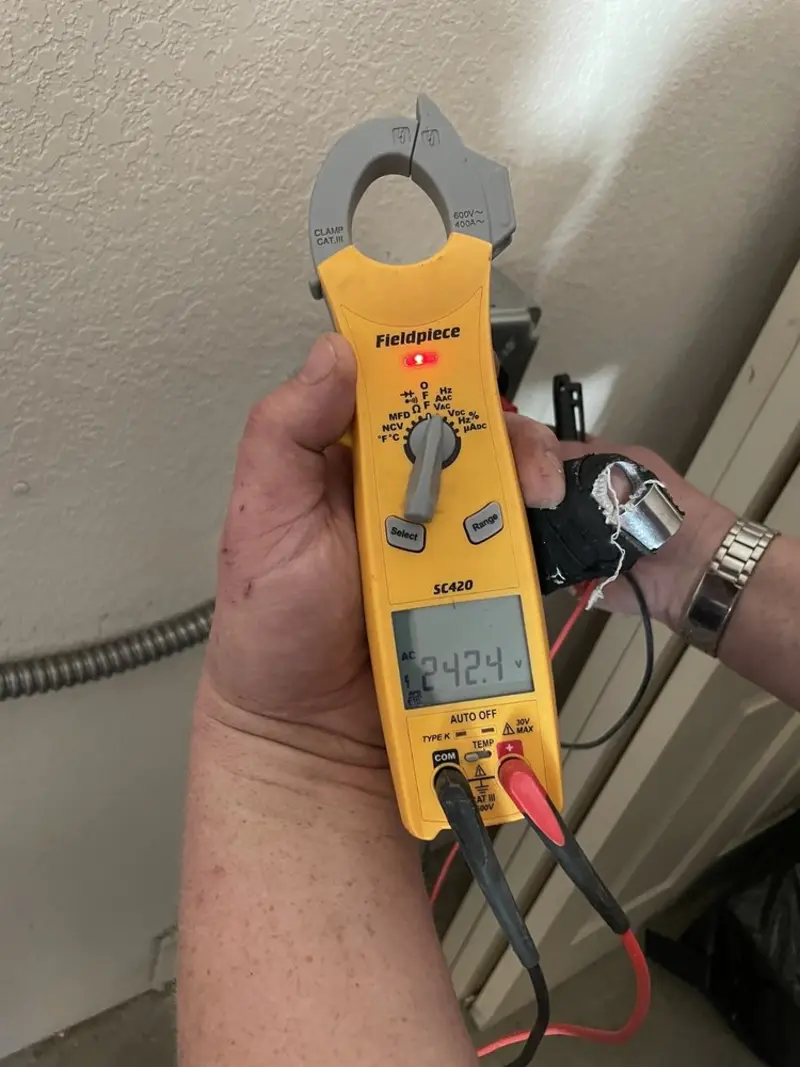 Voltage testing with clamp meter during Ceiling Fan Installation in Carbondale